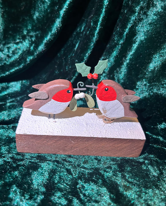 Robins Holding Mistletoe and Holly